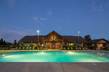 Outdoor pool with tanning shelf